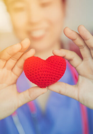 nurse-sharing-love-red-heart-for-health-care-giving